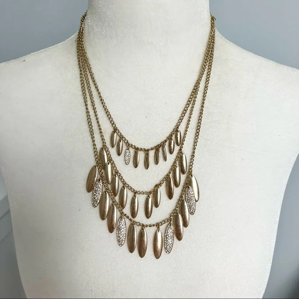 Triple strand gold and rhinestone studded petal necklace